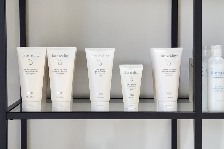 Face Reality Skincare Products on a glass shelf at Linde Esthetics and Wellness Studio in Springfield MO
