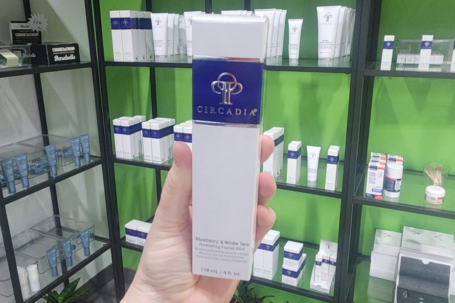 Windy Linde holding a bottle of Circadia Blueberry & White Tea Hydrating Facial Mist at Linde Esthetics & Wellness Studio in Springfield MO