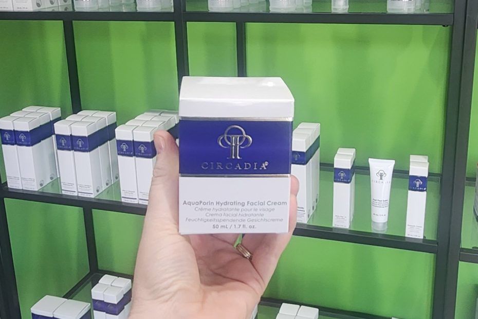 Windy Linde holding a jar of Circadia Aquaporin hydrating cream at Linde Esthetics and Wellness Studio in springfield missouri