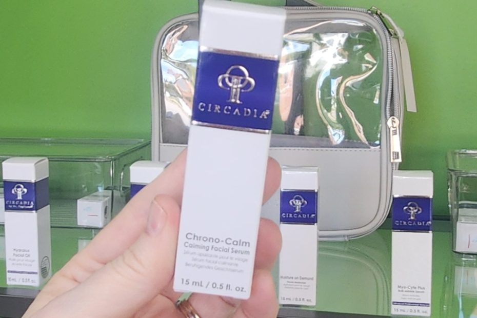 Windy Linde holding a bottle of Circadia Chrono-Calm Serum at Linde Esthetics & Wellness Studio in Springfield MO