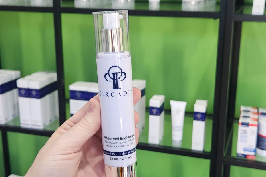 Windy Linde holding a bottle of Circadia White Veil Brightener at Linde Esthetics & Wellness Studio in Springfield MO