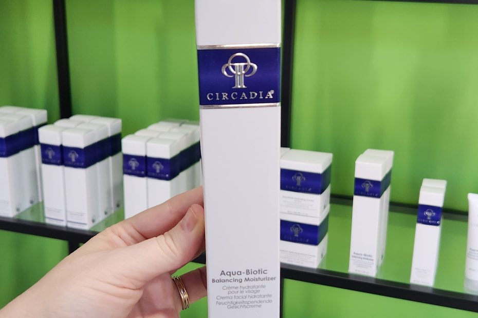 Windy Linde holding a bottle of Circadia Aqua-Biotic Balancing Moisturizer at Linde Eshtetics & Wellness Studio in Springfield MO