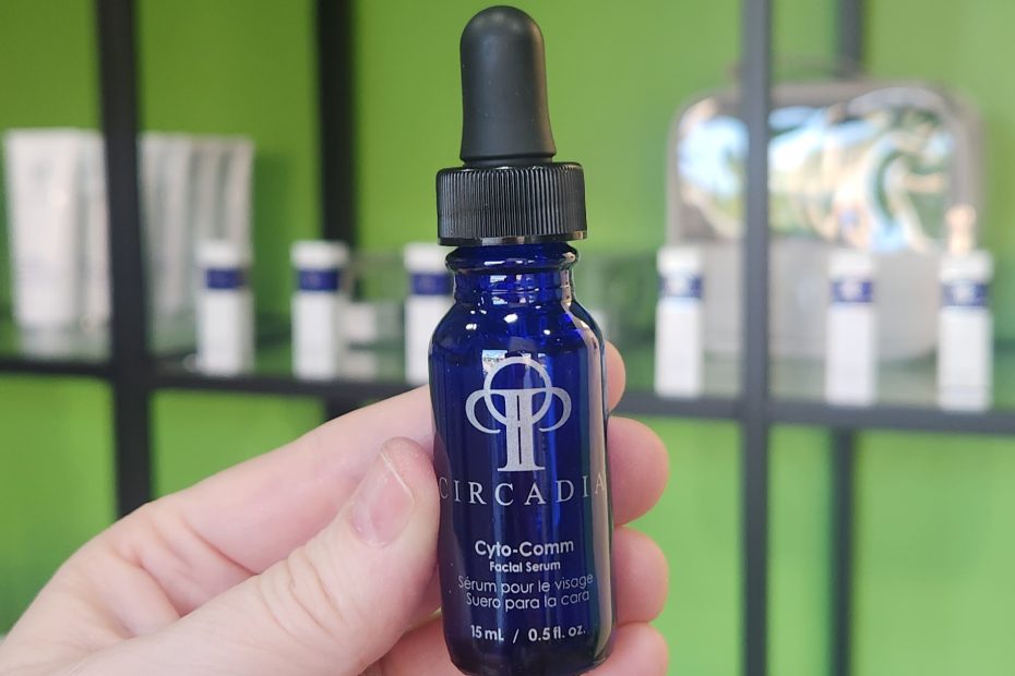 Windy Linde holding a bottle of Circadia Cyto-Comm Serum at Linde Esthetics & Wellness Studio in Springfield MO