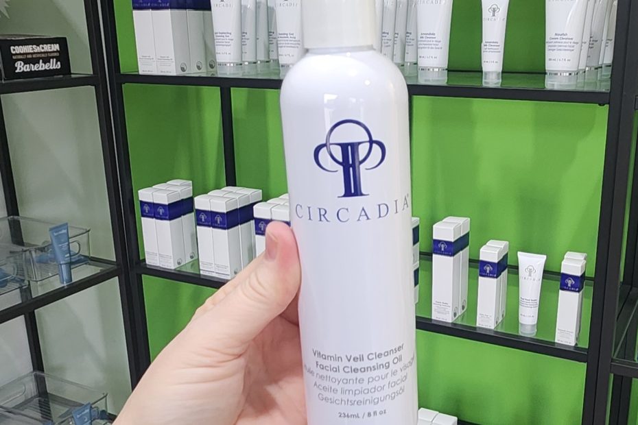 Windy Linde holding a bottle of Circadia Vitamin Veil Facial Cleansing Oil at Linde Esthetics & Wellness Studio in Springfield MO